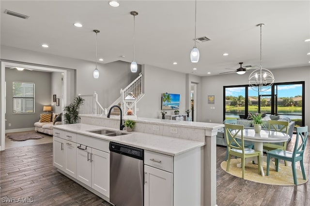 kitchen featuring dark wood finished floors, visible vents, open floor plan, a sink, and dishwasher