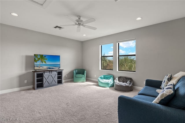 living area featuring carpet floors, baseboards, and recessed lighting