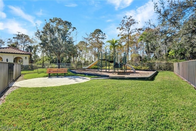 exterior space with a fenced backyard and playground community