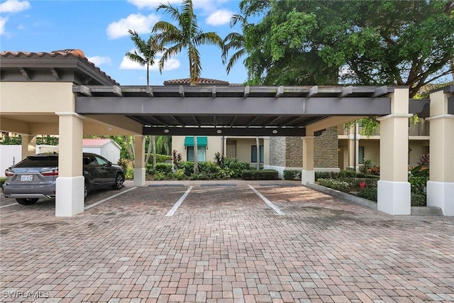 view of vehicle parking with a carport