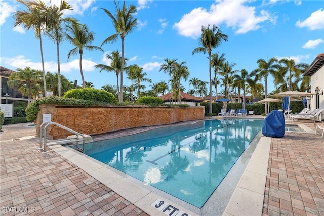 view of swimming pool with a patio area