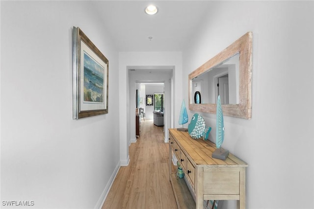 corridor featuring light hardwood / wood-style floors