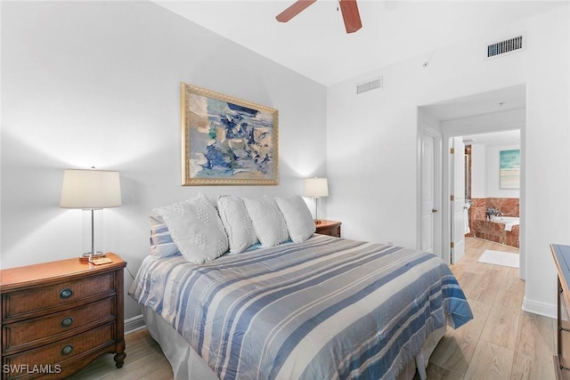 bedroom featuring ensuite bathroom, ceiling fan, and light hardwood / wood-style floors