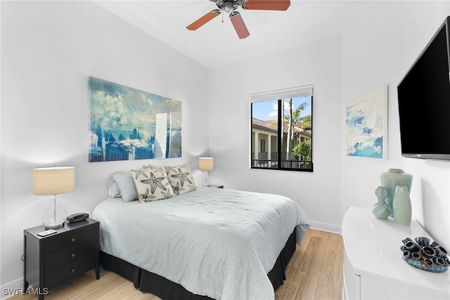 bedroom with ceiling fan and light wood-type flooring