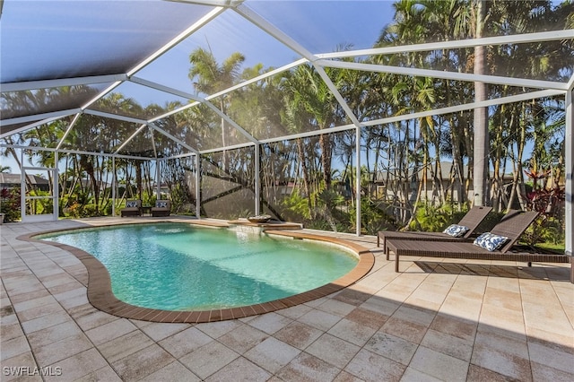 view of pool with a lanai and a patio area