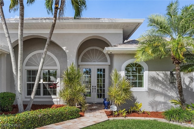 view of exterior entry featuring french doors