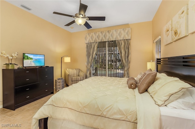 tiled bedroom featuring ceiling fan