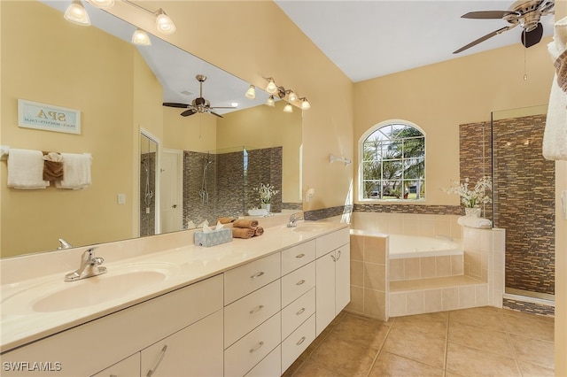 bathroom with ceiling fan, vanity, tile patterned flooring, vaulted ceiling, and independent shower and bath