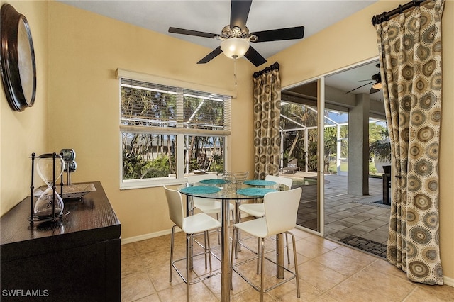 tiled dining area featuring ceiling fan and a healthy amount of sunlight