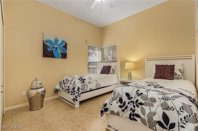 bedroom featuring light tile patterned flooring and ceiling fan