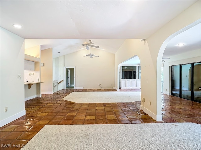 interior space featuring vaulted ceiling and ceiling fan