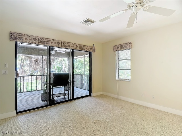 empty room with carpet floors and ceiling fan