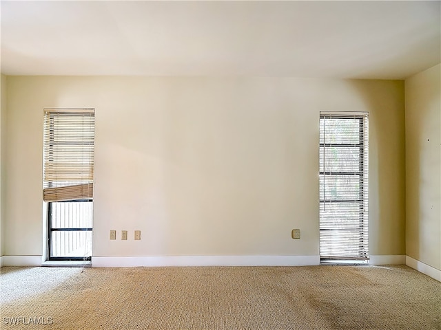 empty room featuring carpet flooring