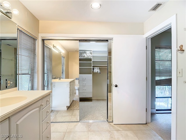 bathroom featuring tile patterned floors and vanity