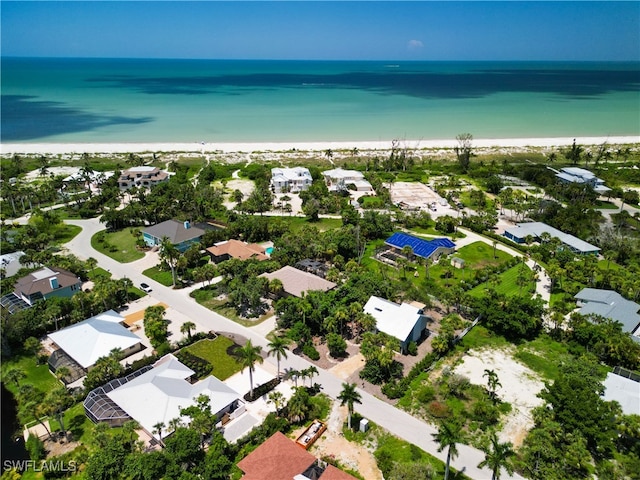 aerial view featuring a water view and a beach view