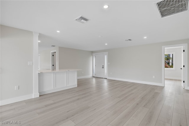 unfurnished living room with light wood-type flooring