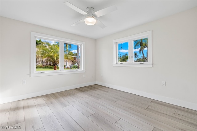 spare room featuring ceiling fan and light wood-type flooring