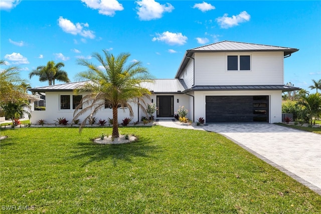 modern farmhouse with a front lawn and a garage