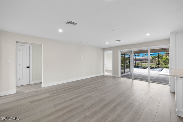 spare room with light hardwood / wood-style floors