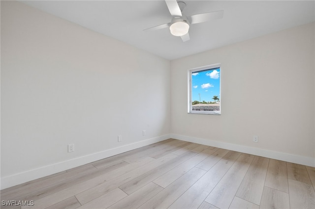 empty room with light wood-type flooring and ceiling fan