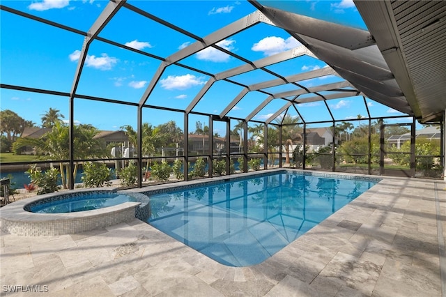 view of swimming pool with a patio, an in ground hot tub, and a lanai