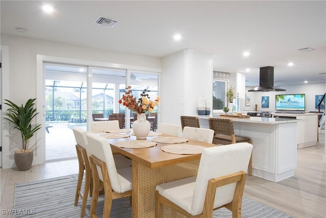 dining space featuring light hardwood / wood-style flooring