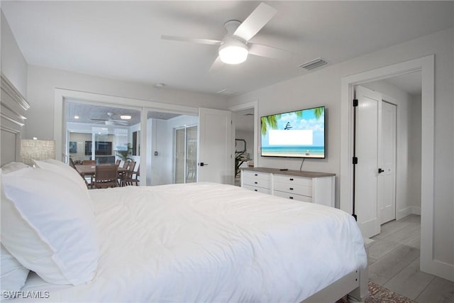 bedroom featuring light hardwood / wood-style floors and ceiling fan