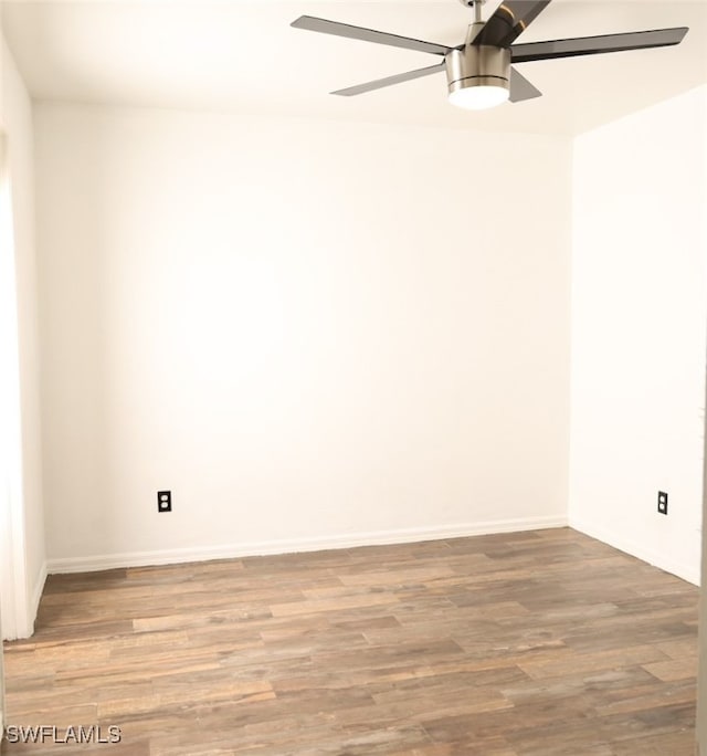 spare room with wood-type flooring and ceiling fan