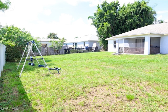 view of yard with a sunroom