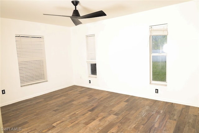 unfurnished room featuring ceiling fan and dark hardwood / wood-style flooring