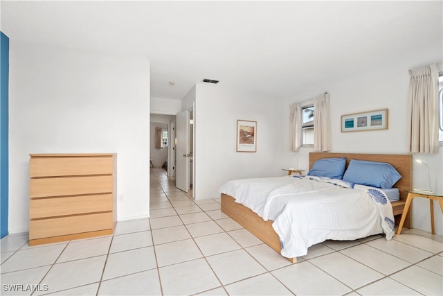 bedroom featuring light tile patterned flooring