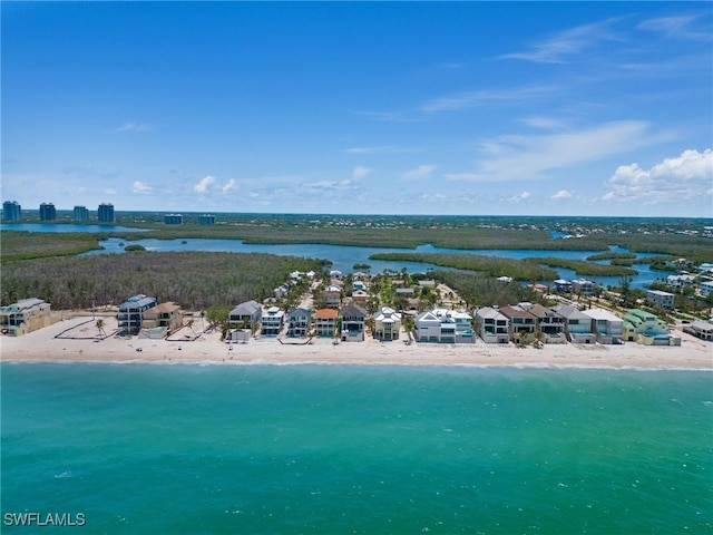 bird's eye view with a water view and a view of the beach