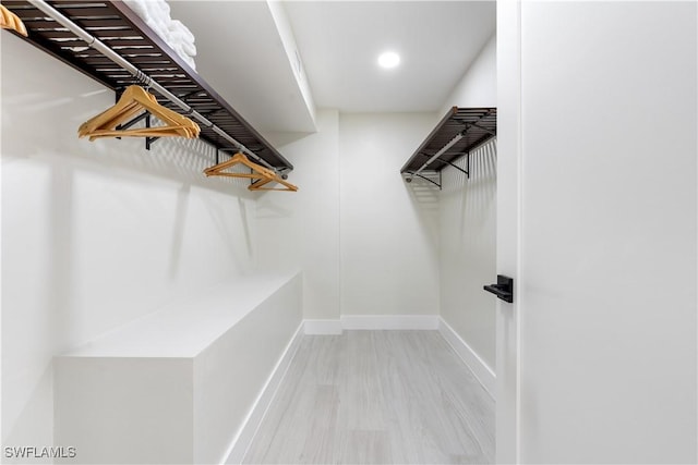 990 8th St S Unit 1B, Naples, FL 34102 - spacious closet featuring wood finished floors