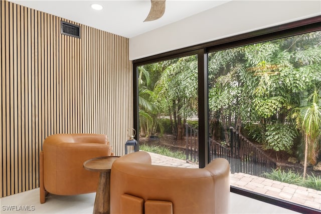 sitting room featuring ceiling fan