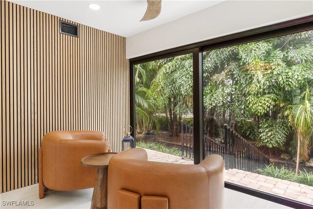990 8th St S Unit 1B, Naples, FL 34102 - living area with recessed lighting and a ceiling fan