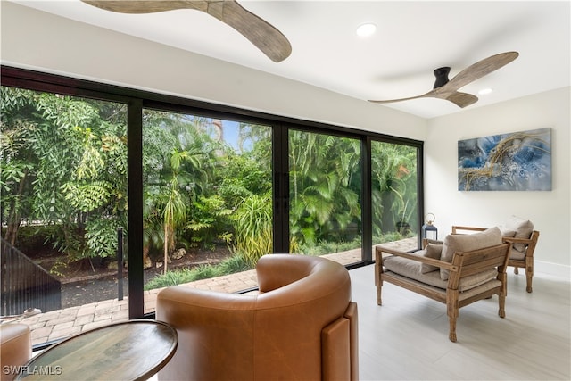 interior space with ceiling fan