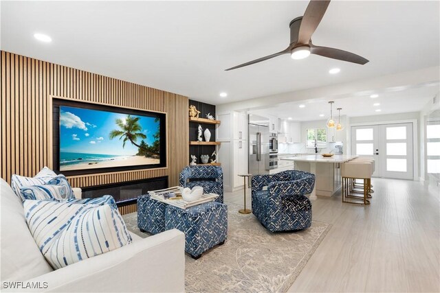 990 8th St S Unit 1B, Naples, FL 34102 - living area with ceiling fan, recessed lighting, and light wood-style flooring