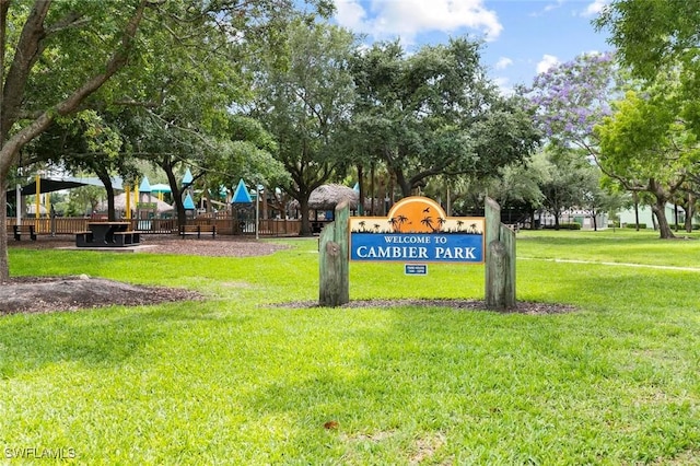 990 8th St S Unit 1B, Naples, FL 34102 - view of community with a lawn and playground community