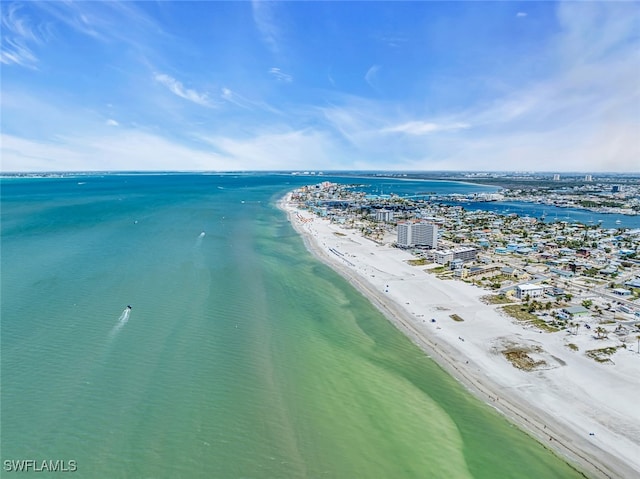 drone / aerial view featuring a water view and a view of the beach