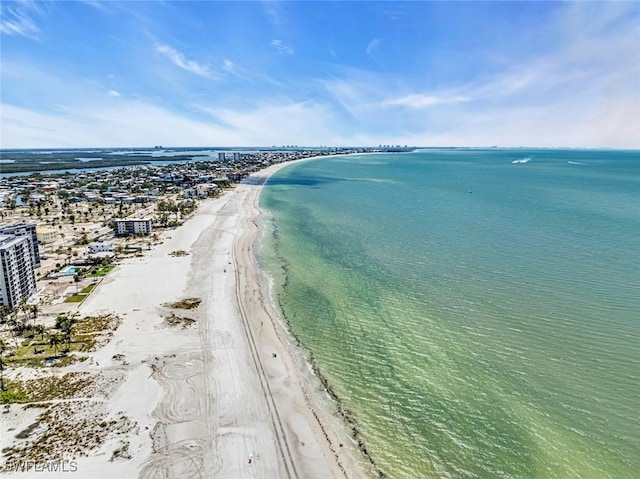 birds eye view of property featuring a view of the beach and a water view