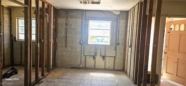 bathroom with concrete block wall