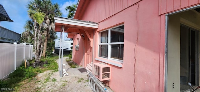 view of side of home with fence