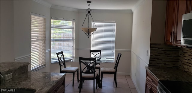 tiled dining space with crown molding