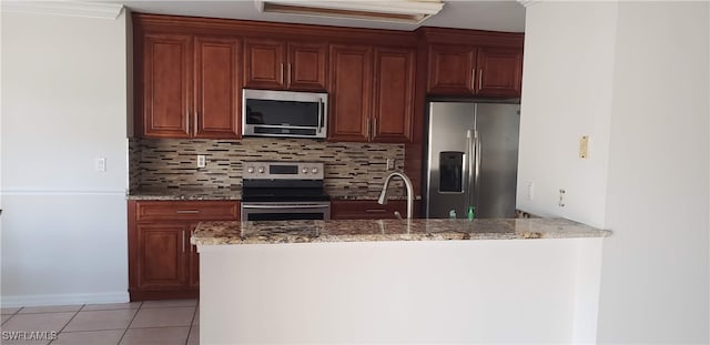 kitchen with sink, stainless steel appliances, light stone countertops, ornamental molding, and light tile patterned floors