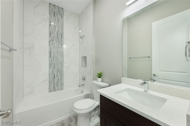 bathroom featuring vanity, toilet, and shower / washtub combination