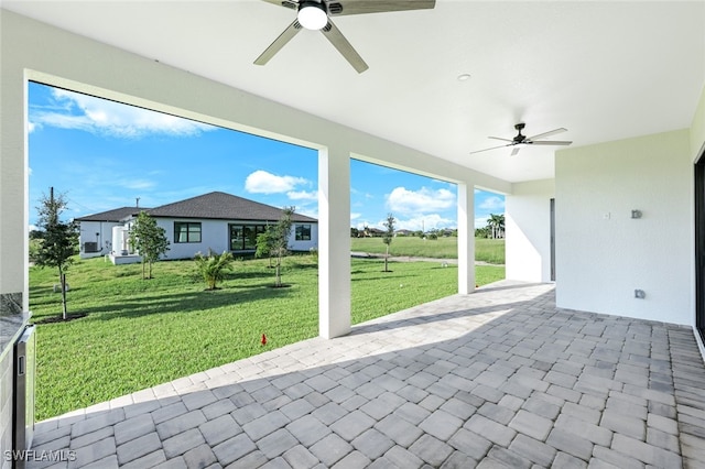 view of patio featuring a ceiling fan