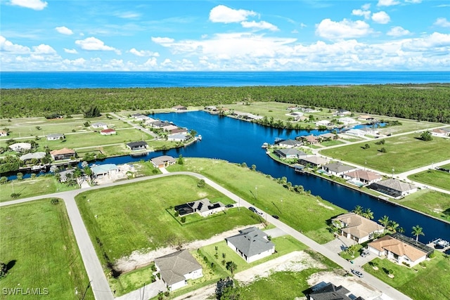 aerial view featuring a residential view and a water view