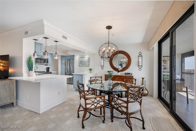 carpeted dining room with sink, crown molding, and a chandelier