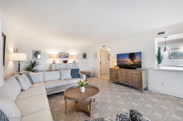 carpeted living room with crown molding