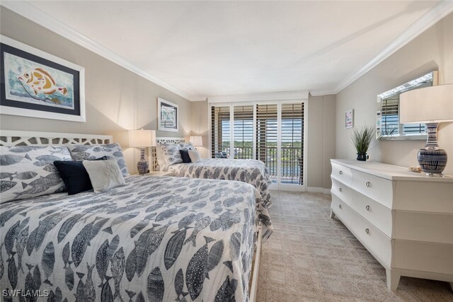 carpeted bedroom with ornamental molding and access to exterior